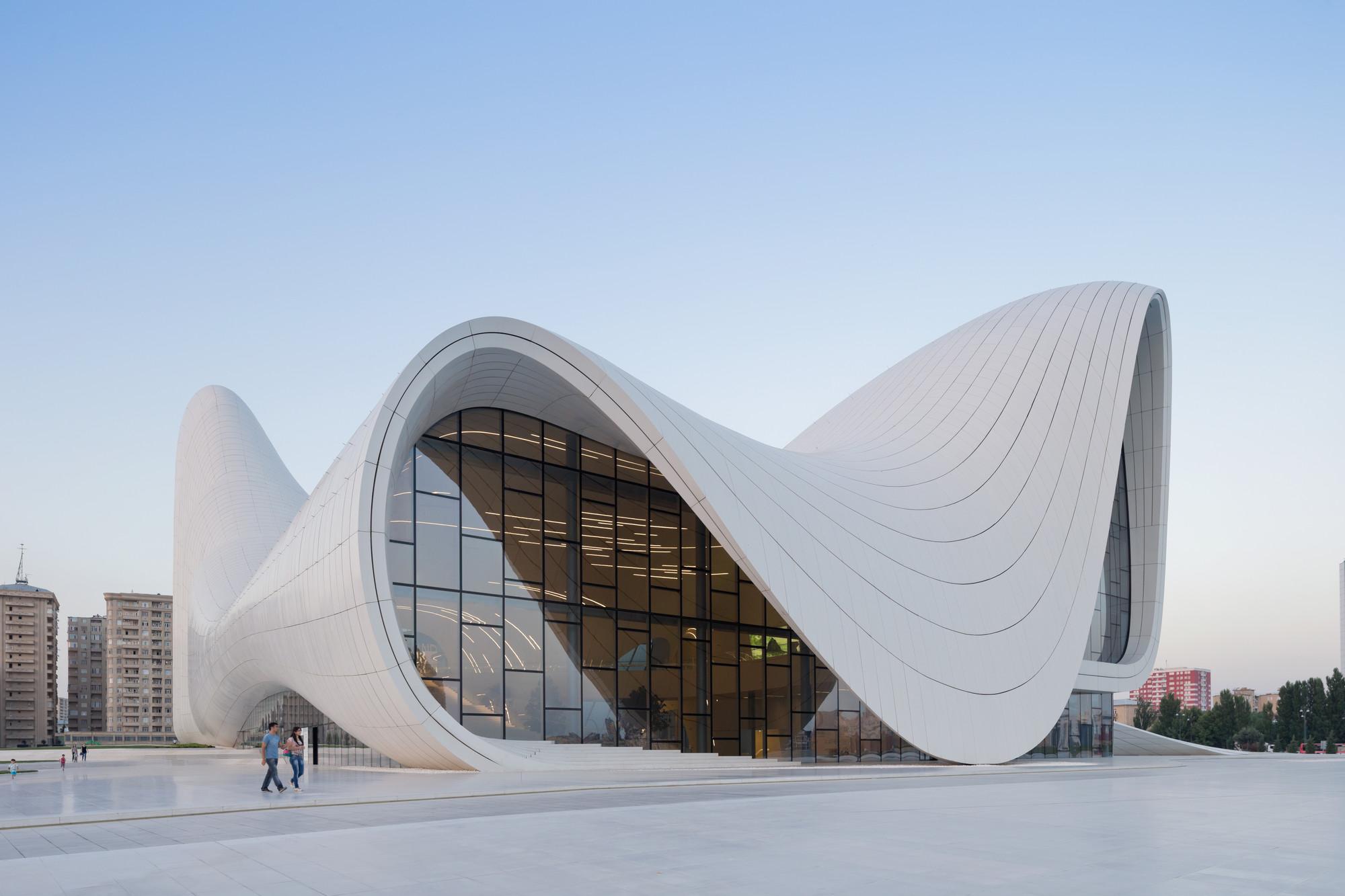 <h3>HEYDAR ALIYEV CULTURAL CENTER</h3>The Heydar Aliyev Center in Baku, Azerbaijan, is a cultural complex and architectural masterpiece designed by the renowned architect Zaha Hadid. Named after Heydar Aliyev, the former president of Azerbaijan, the center is celebrated for its fluid, futuristic design characterized by curved, flowing forms that seamlessly blend into one another. The building's distinctive structure lacks sharp angles and corners, creating a sense of movement and fluidity. Inside, the center hosts exhibitions on Azerbaijani culture, history, and contemporary art, showcasing the country's rich heritage and modern achievements. The Heydar Aliyev Center has become an iconic symbol of Baku's transformation into a cultural hub and a testament to Zaha Hadid's innovative architectural vision.