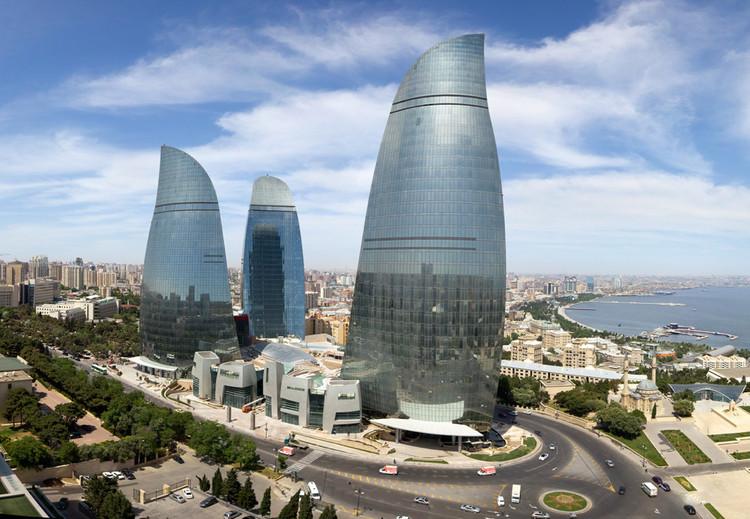 <h3>FLAME TOWERS</h3>The Flame Towers are iconic skyscrapers in Baku, Azerbaijan, known for their striking design and prominent presence on the city skyline. Comprising three towers, each reaching heights of over 180 meters, they are named for their flame-like shape and dynamic LED lighting system that illuminates the night sky, symbolizing Azerbaijan's historical connection to fire and energy resources. The towers house luxury hotels, residential apartments, offices, and observation decks, offering panoramic views of Baku and the Caspian Sea. Designed by HOK Architects, the Flame Towers are not only a modern architectural marvel but also a symbol of Baku's rapid development and aspiration as a global city. They have become a defining feature of Baku's skyline and a must-see for visitors to the city.