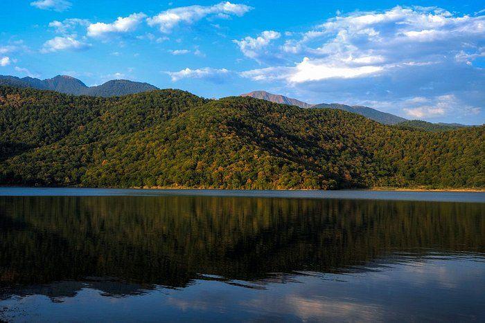 <h3>NOHUR LAKE</h3>This tranquil lake is nestled amidst lush green hills and offers a peaceful retreat. Visitors can take boat rides on the lake, relax by the shore, or enjoy a picnic surrounded by nature. The area around Nohur Lake is also known for its charming villages and traditional Azerbaijani architecture.