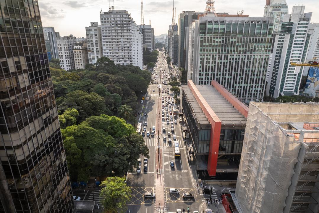 <h3>AVENIDA PAULISTA</h3>Avenida Paulista is São Paulo's bustling cultural and financial heart, known for its skyscrapers, museums, and vibrant atmosphere. At its center stands the São Paulo Museum of Art (MASP), famous for its modernist architecture and impressive art collection. The avenue itself is a hub of activity, with street performers, art exhibitions, and a diverse range of dining options, from upscale restaurants to casual cafes. Visitors can take a leisurely stroll along the wide sidewalks, shop at designer boutiques, or simply soak in the energy of this iconic urban landscape.