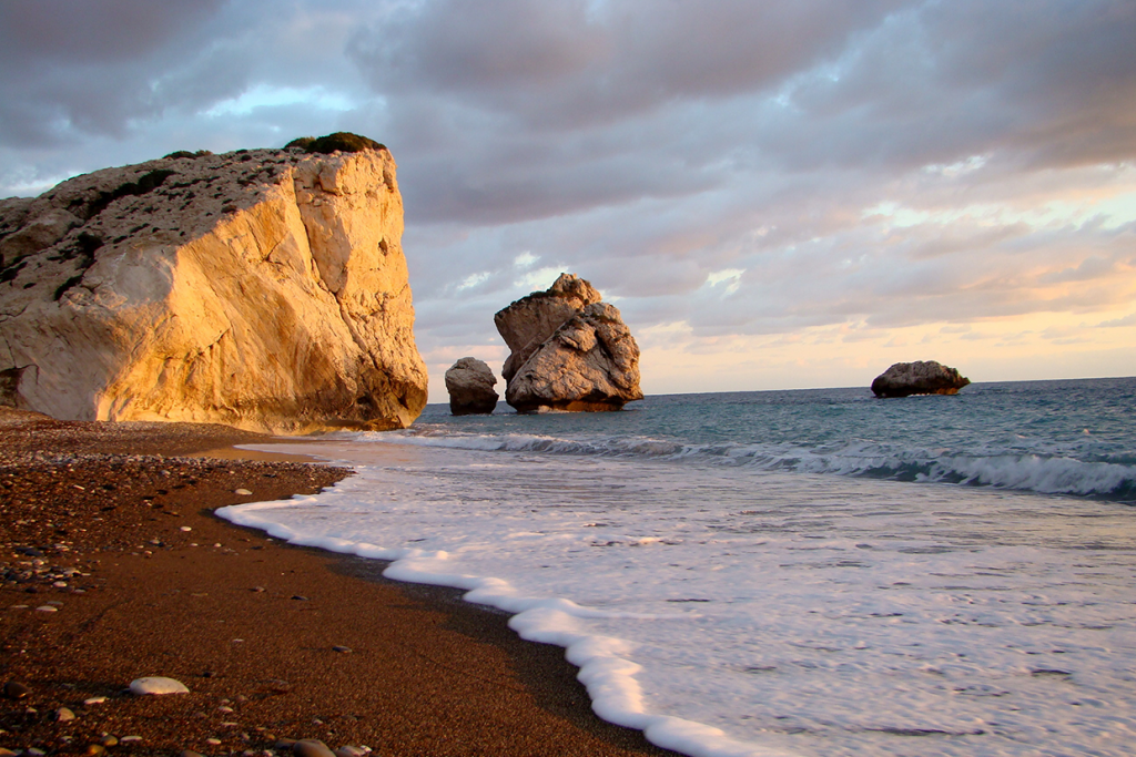 <h3>APHRODITE'S ROCK</h3>According to mythology, this sea stack off the southwest coast of Cyprus is the legendary birthplace of Aphrodite, the Greek goddess of love and beauty. The striking rock formation is a popular tourist attraction and offers stunning views of the Mediterranean Sea. It's an ideal spot for taking photos, enjoying the coastal scenery, and soaking in the mythological significance of the area.