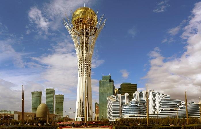 <h3>BAYTEREK TOWER</h3>The Bayterek Tower is an iconic landmark and symbol of Nur-Sultan, Kazakhstan. Standing at 97 meters tall, this futuristic monument represents a Kazakh mythological tree of life and a golden egg laid by the magical bird, Samruk. Visitors can ascend the tower to its observation deck, located in the golden sphere at the top, which offers panoramic views of Nur-Sultan's skyline and the Ishim River. At the base of the tower, there is a handprint of Nursultan Nazarbayev, the first President of Kazakhstan, symbolizing his role in the city's transformation and development. The Bayterek Tower is not only a tourist attraction but also a symbolic representation of Kazakhstan's aspirations and progress as a nation.