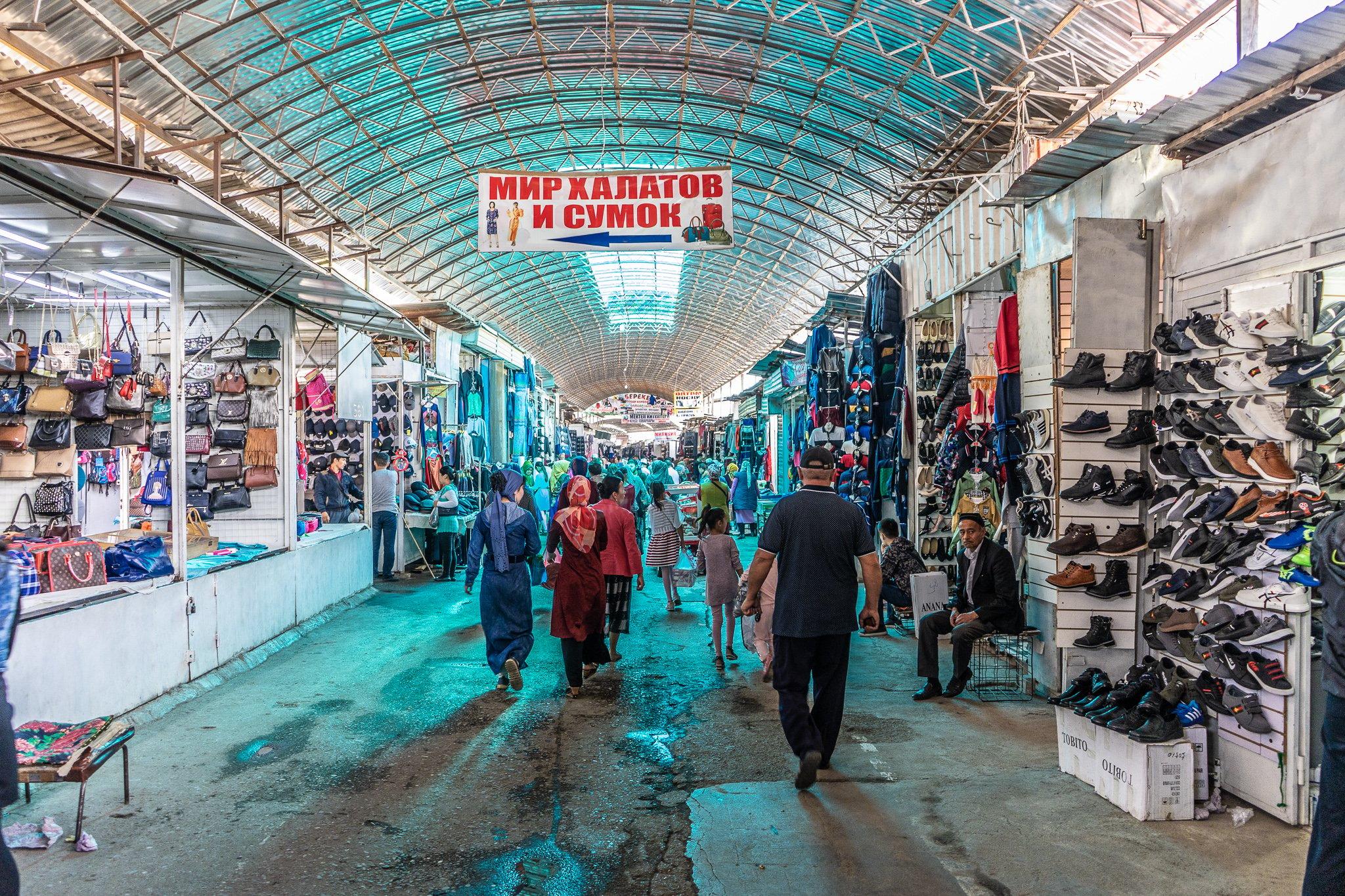 <h3>OSH BAZAAR</h3>Osh Bazaar, one of Bishkek's largest and most vibrant markets, offers a sensory immersion into Kyrgyzstan's culture and daily life. Located near the city center, it teems with stalls selling a diverse array of goods, from fresh produce and spices to traditional crafts and clothing. The market's lively atmosphere and bustling activity make it a favorite among locals and tourists alike, providing an opportunity to sample local snacks and dishes at the food stalls scattered throughout. Osh Bazaar is not only a place to shop but also a cultural experience where visitors can witness the lively interactions of vendors and shoppers amidst the colorful sights and sounds of Bishkek's bustling marketplace.