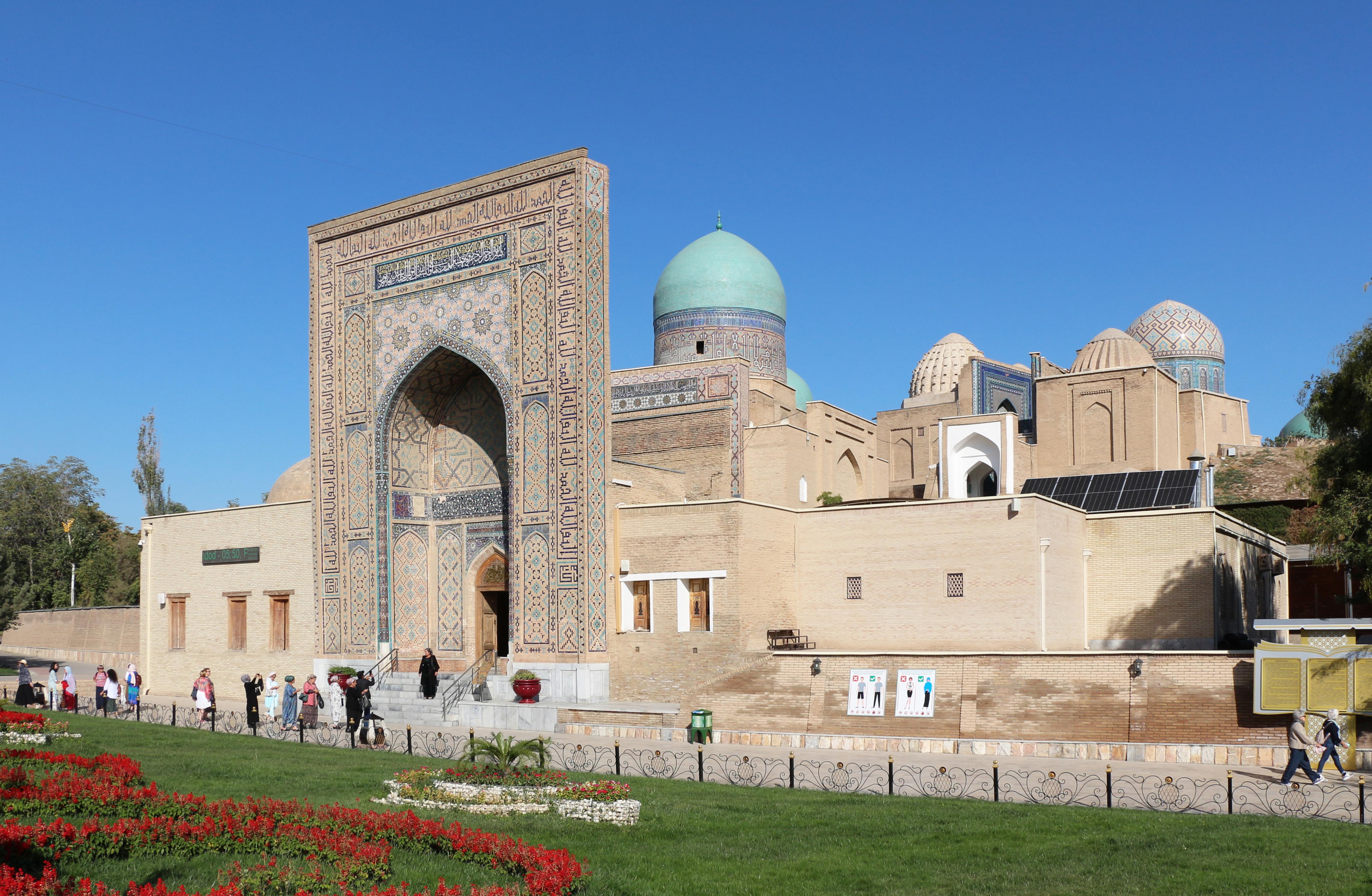 <h3>SHAH-I ZINDA</h3>This ancient necropolis is a sacred site featuring a series of beautifully decorated mausoleums and tombs dating from the 9th to 14th centuries. The name Shah-i-Zinda means 'Living King' in Persian, referencing a legend that a cousin of Prophet Muhammad is buried here and continues to live. The tile work and architectural details make Shah-i-Zinda a masterpiece of Islamic art and a testament to Samarkand's spiritual heritage.